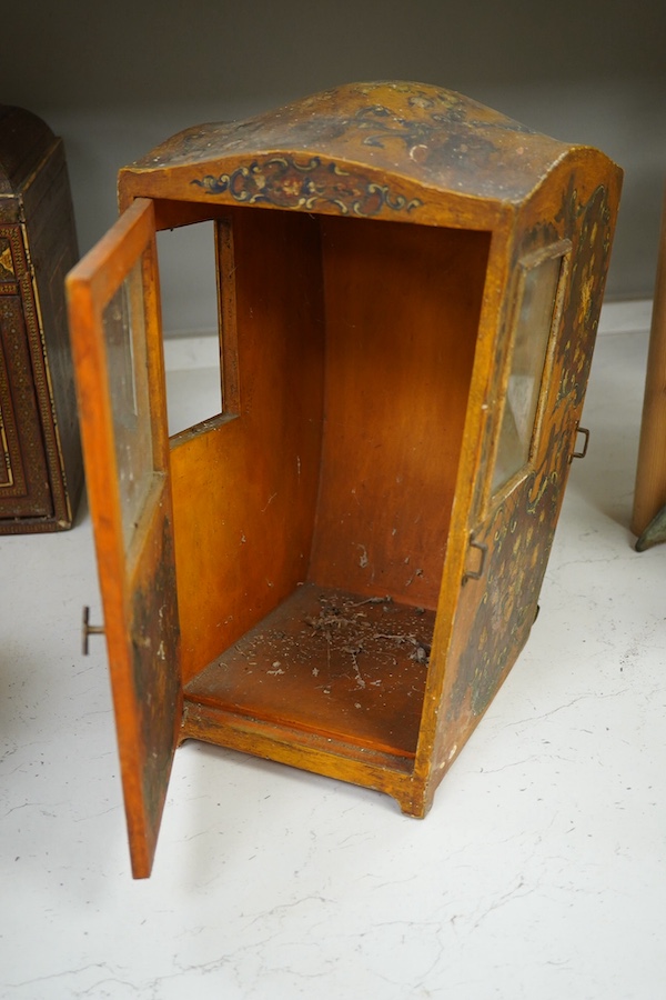 A Venetian painted wooden model of a sedan chair, probably designed for a doll, 36cm high. Condition - some crazing to the painted cartouche decoration, gilt worn, One glass panel missing